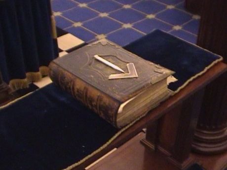 Holy Bible topped with square and compasses in craft masonry (1st to 3rd degree) lodge room at Bristol Freemasons Hall, Park Street